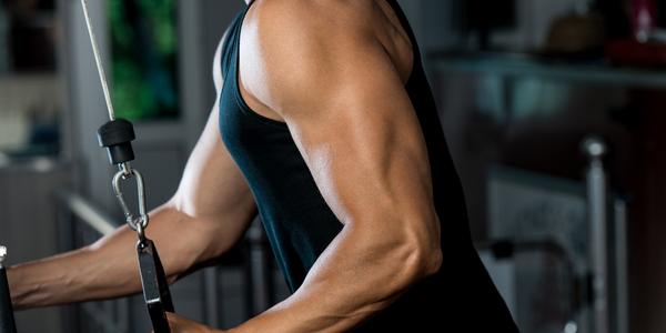 Man doing Tricep Pushdown in the gym