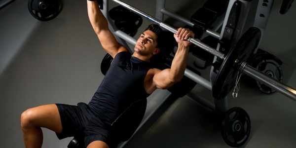 man doing a close grip bench press